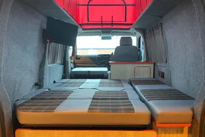 Bed with overhead storage units