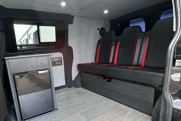 Black and white seats and fridge
