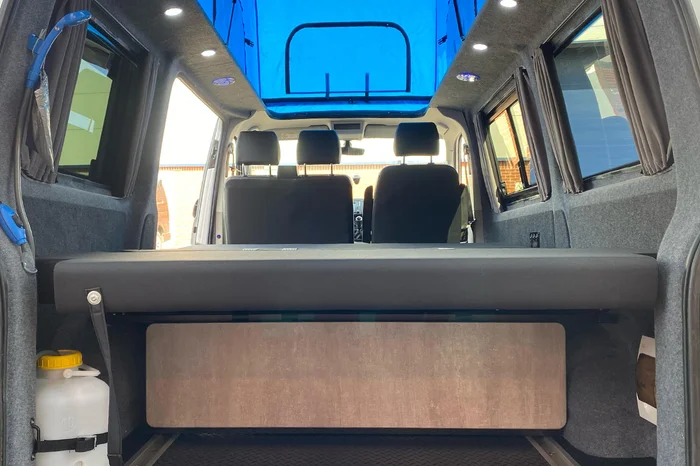 Bed with pop top roof